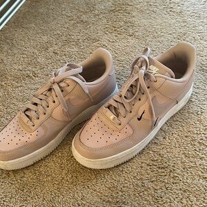 Light pink Nike Air Force ones